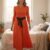 Vestido largo color naranja ruedo completo
