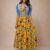 Vestido largo florado amarillo medio ruedo