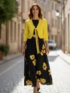 Vestido negro y amarillo flores medio ruedo largo