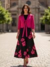 Vestido negro y fushia con flores medio ruedo largo