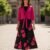 Vestido negro y fushia con flores medio ruedo largo