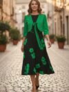 Vestido negro y verde con flores medio ruedo largo