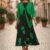 Vestido negro y verde con flores medio ruedo largo