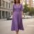 Vestido plisado morado medio ruedo a media pantorrilla